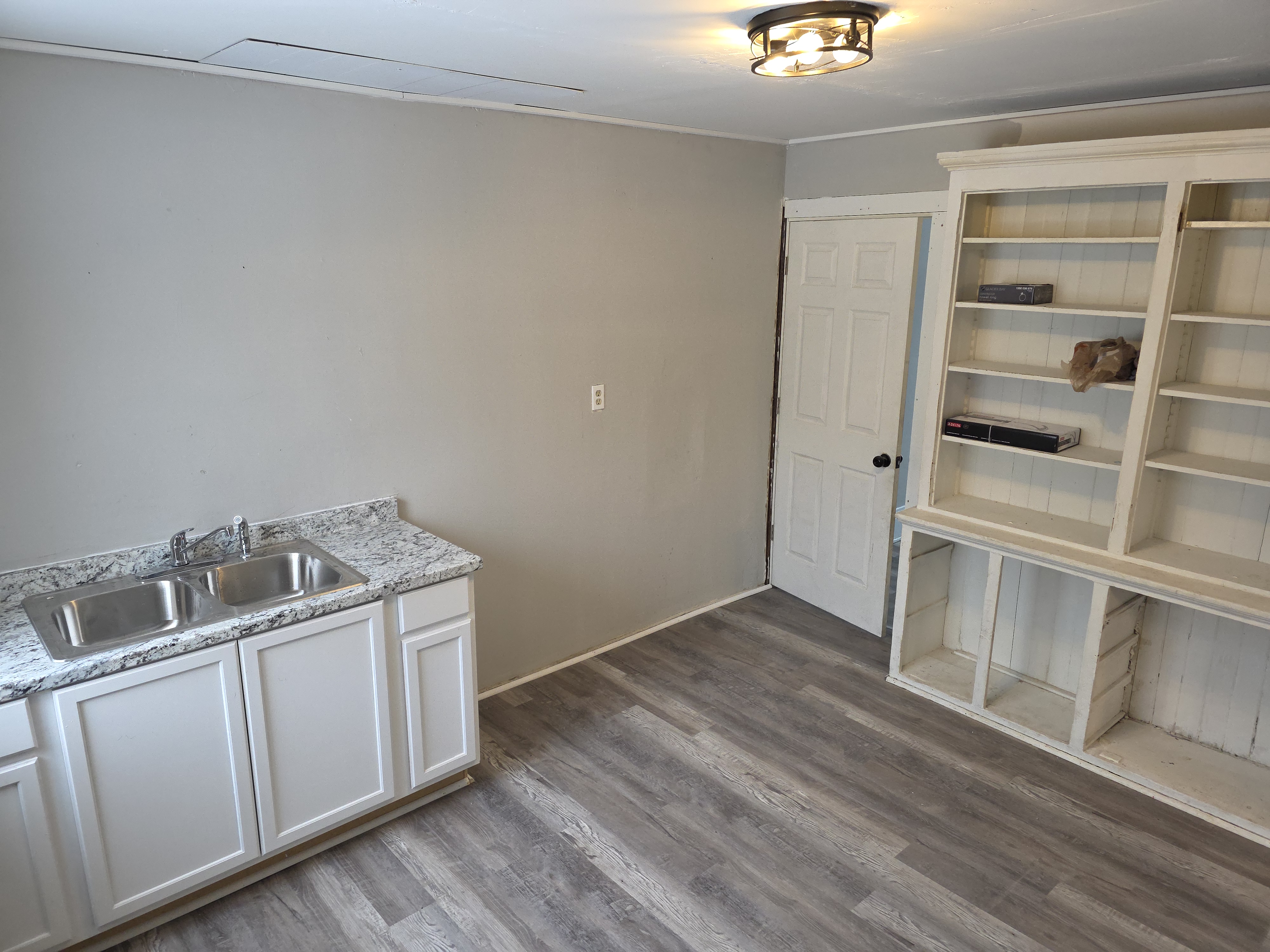 Kitchen turnover — new flooring, cabinets and paint